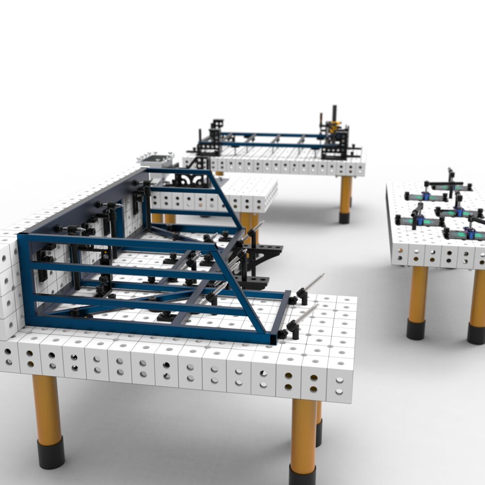 Stoły montażowe z modułami do spawania.